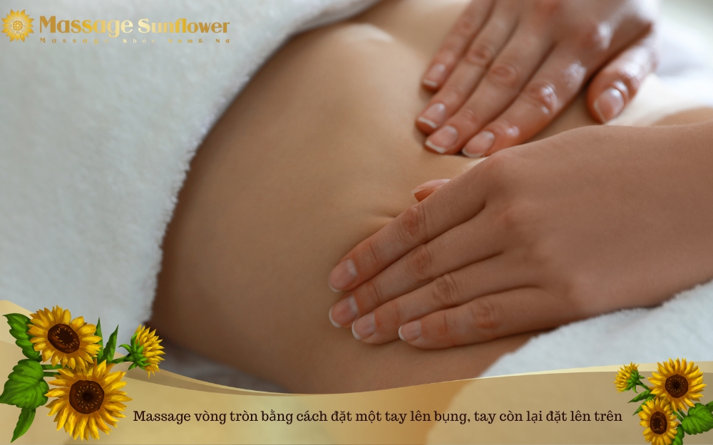 Massage vòng tròn bằng cách đặt một tay lên bụng, tay còn lại đặt lên trên